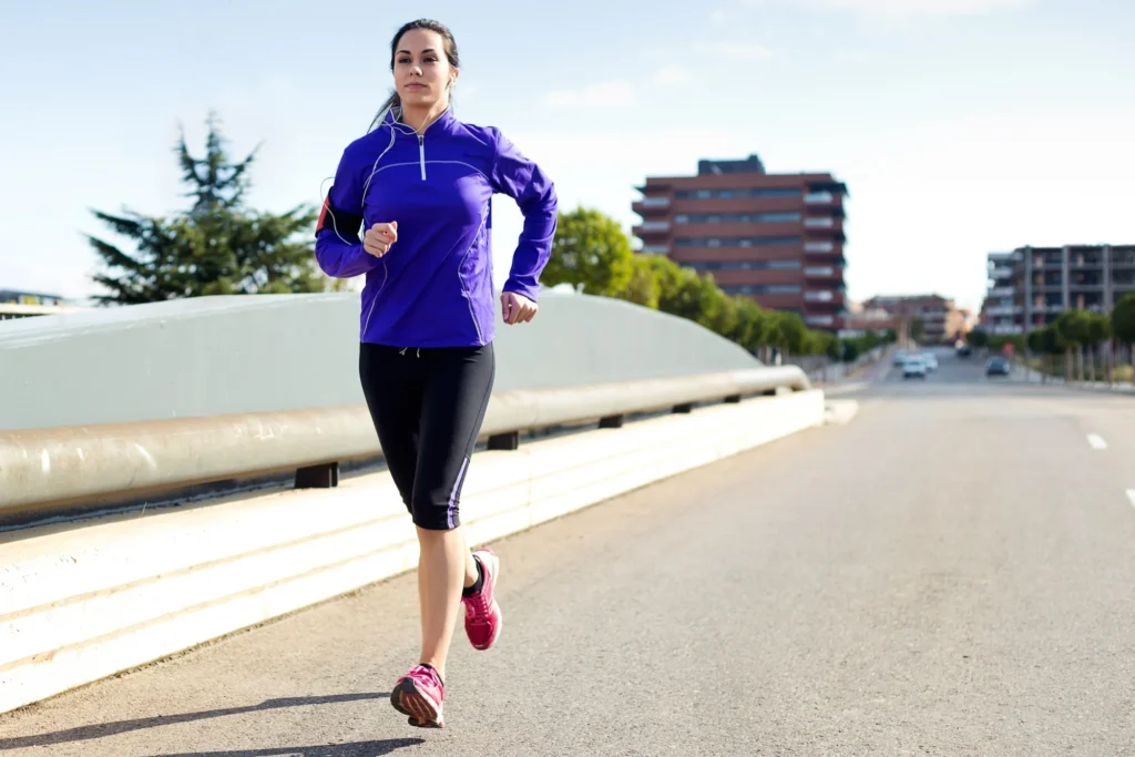 Copy of pretty young woman running city